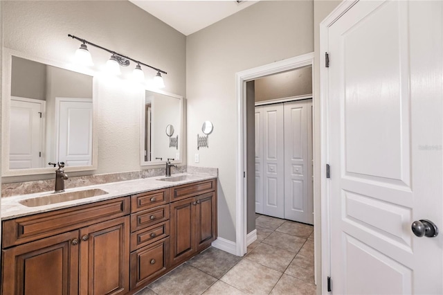 bathroom featuring tile patterned flooring and vanity