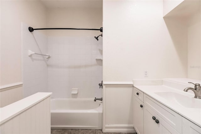 bathroom with vanity and tiled shower / bath combo