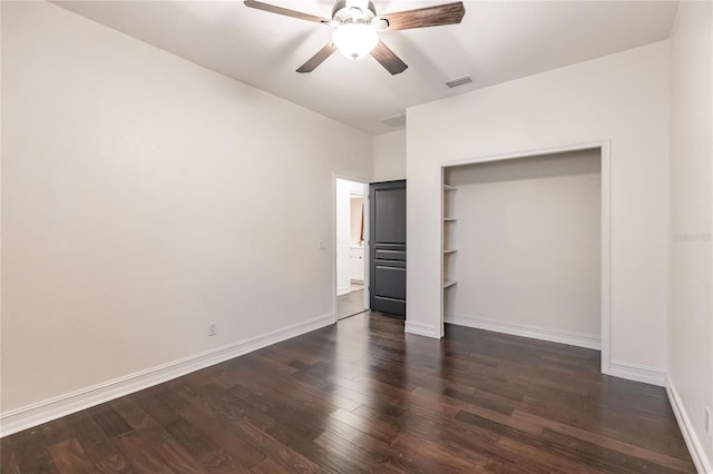 unfurnished bedroom with a closet, ceiling fan, and dark wood-type flooring