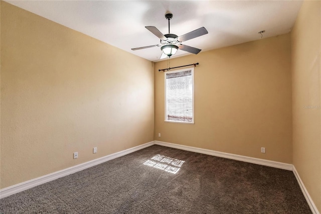 spare room featuring carpet flooring and ceiling fan