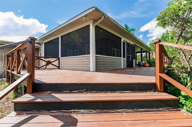 wooden terrace with a sunroom