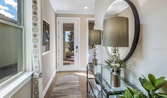 interior space with light wood-type flooring and ornamental molding