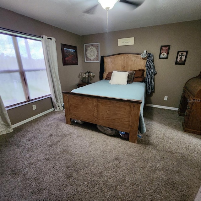 bedroom with ceiling fan and carpet floors