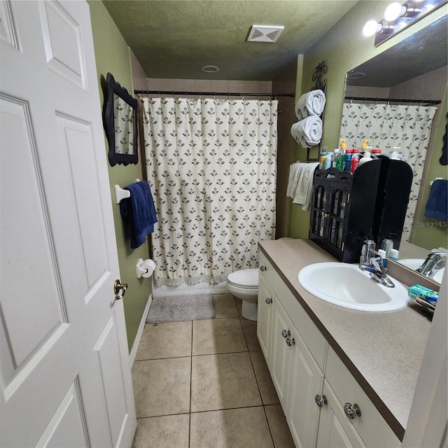 full bathroom with toilet, tile patterned flooring, vanity, a textured ceiling, and shower / tub combo with curtain