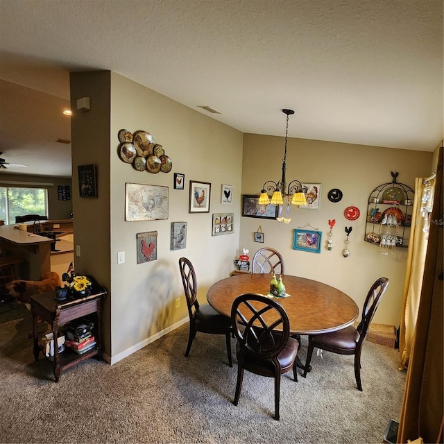 dining room featuring lofted ceiling, a textured ceiling, ceiling fan with notable chandelier, and carpet