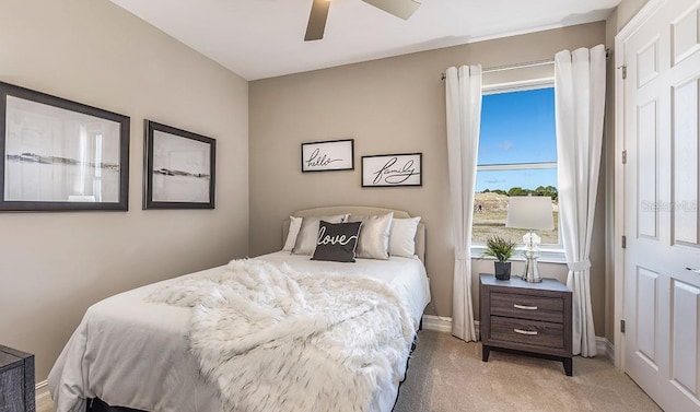 carpeted bedroom with ceiling fan