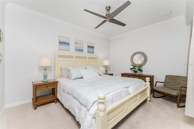 carpeted bedroom with crown molding and ceiling fan