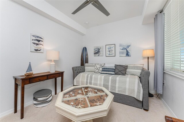 bedroom featuring light colored carpet and ceiling fan