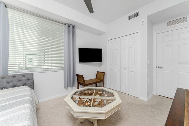 bedroom with carpet flooring, a closet, and ceiling fan