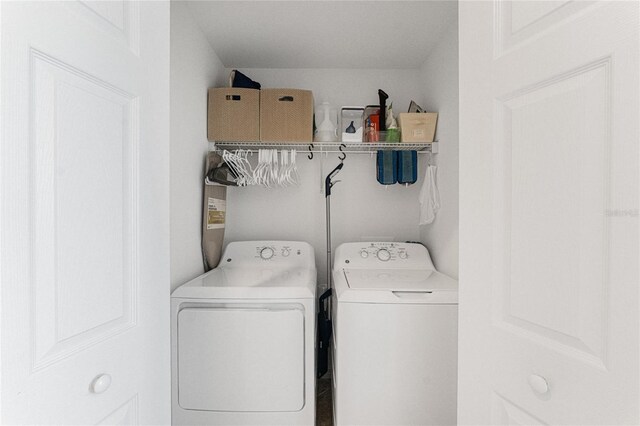 washroom featuring washer and clothes dryer