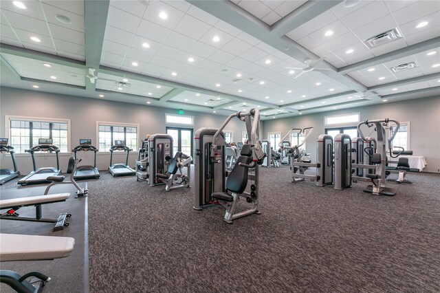 workout area with coffered ceiling