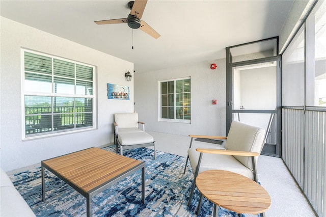 sunroom featuring ceiling fan