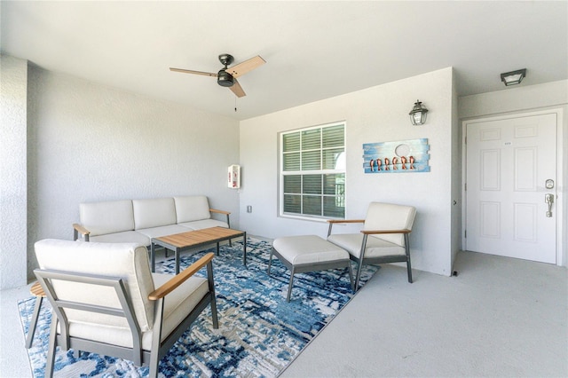 view of patio with an outdoor living space and ceiling fan