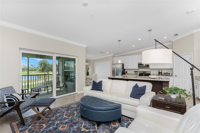 living room featuring lofted ceiling, tile patterned flooring, and ornamental molding