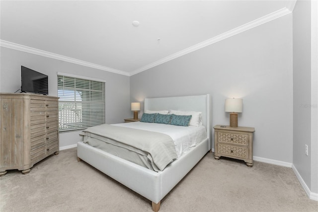 bedroom with ornamental molding and carpet