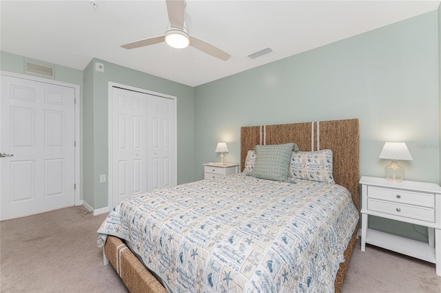 bedroom with light carpet, a closet, and ceiling fan