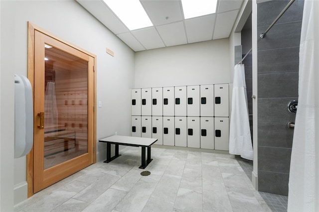 interior space with mail boxes and a paneled ceiling