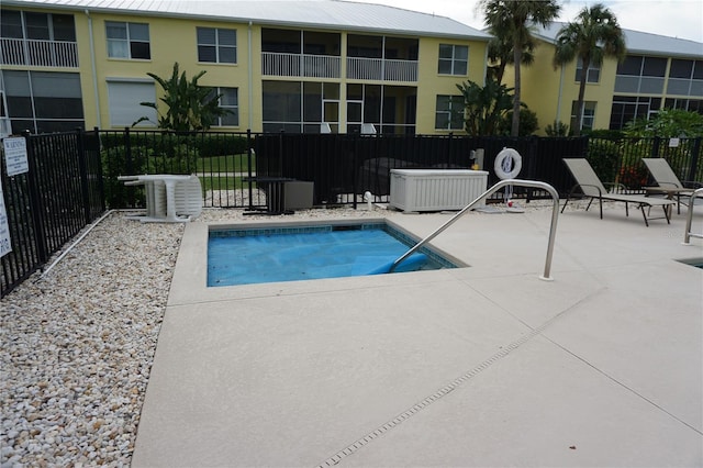 view of swimming pool with a patio area