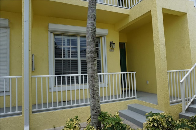 property entrance featuring covered porch