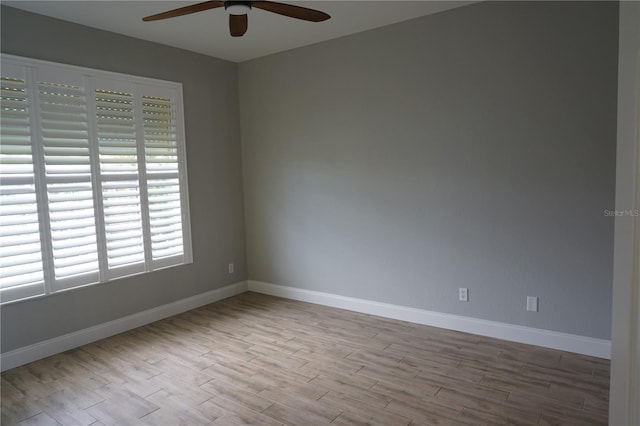 spare room featuring ceiling fan and light hardwood / wood-style floors