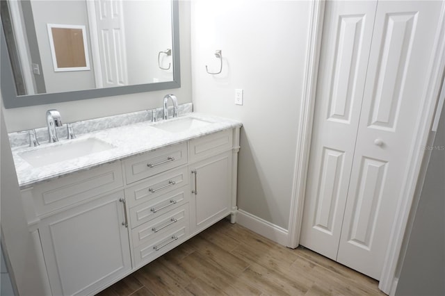 bathroom with vanity and hardwood / wood-style flooring