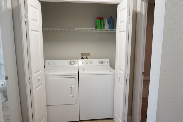 laundry area with washing machine and clothes dryer