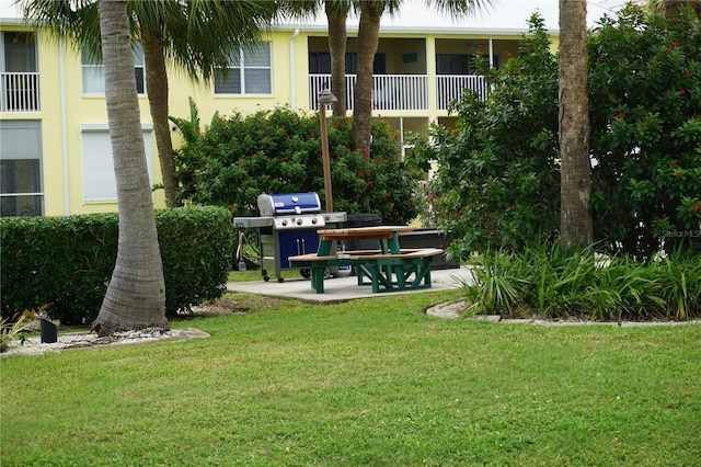 view of home's community with a yard