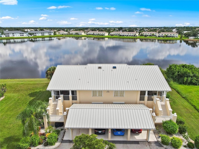 birds eye view of property with a water view