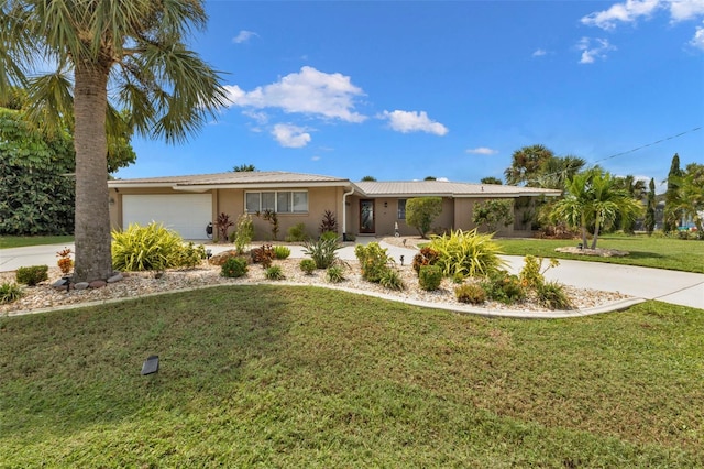 single story home with a garage and a front lawn