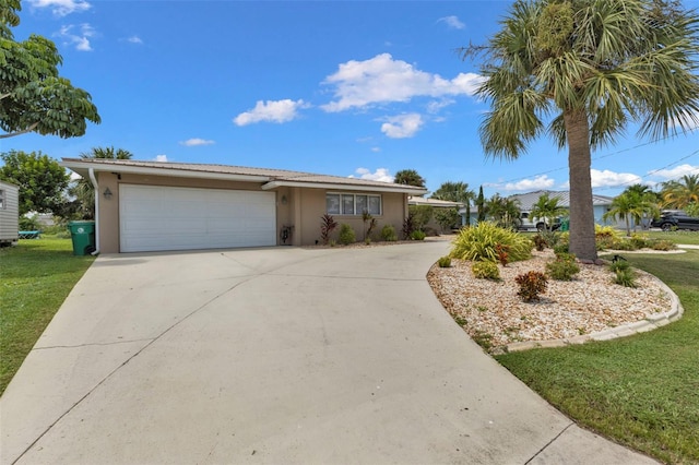 ranch-style house with a garage and a front lawn