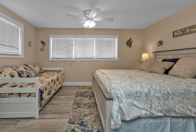 bedroom featuring ceiling fan and light hardwood / wood-style floors