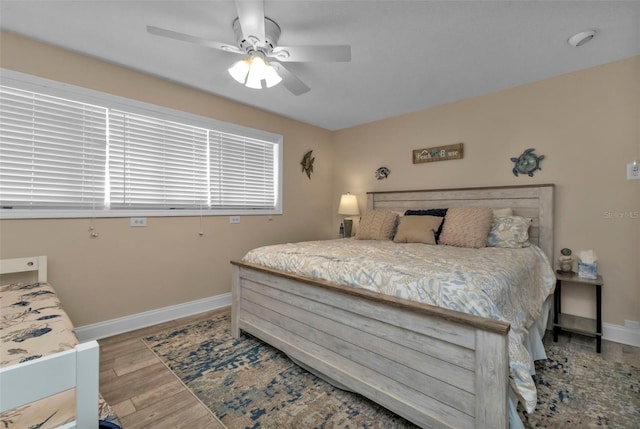 bedroom featuring light hardwood / wood-style flooring and ceiling fan