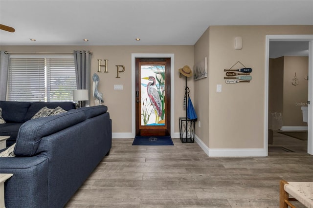 entrance foyer featuring wood-type flooring and ceiling fan