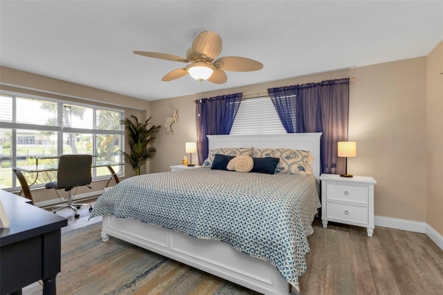 bedroom featuring hardwood / wood-style flooring and ceiling fan