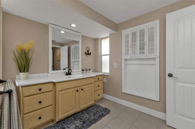 bathroom with tile patterned flooring and vanity