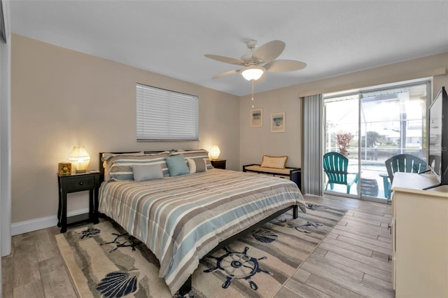 bedroom featuring ceiling fan, access to outside, and light hardwood / wood-style flooring