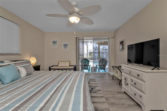 bedroom with access to exterior, ceiling fan, and light hardwood / wood-style floors