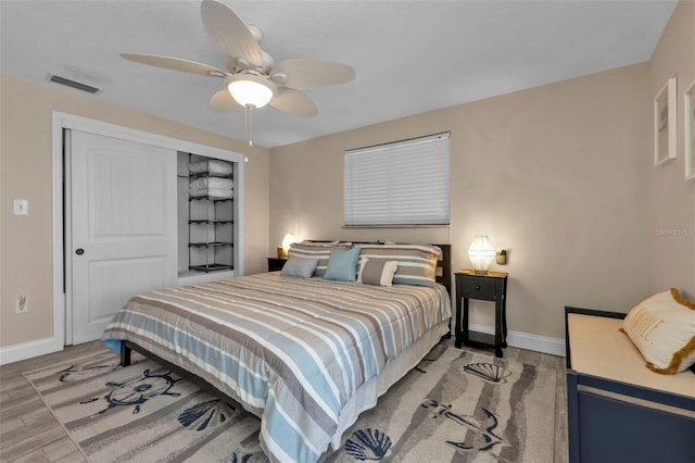 bedroom with hardwood / wood-style floors and ceiling fan