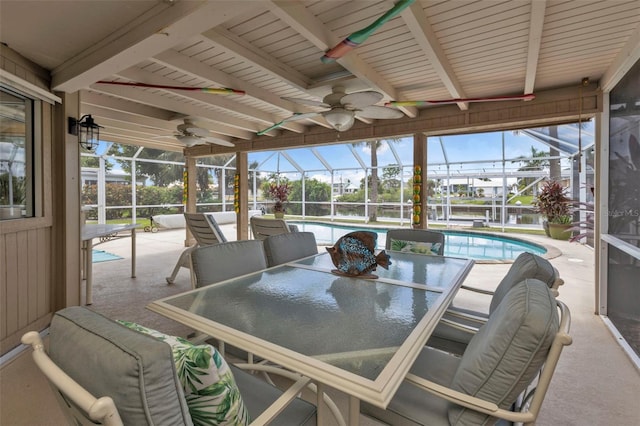 view of patio / terrace featuring ceiling fan and a lanai