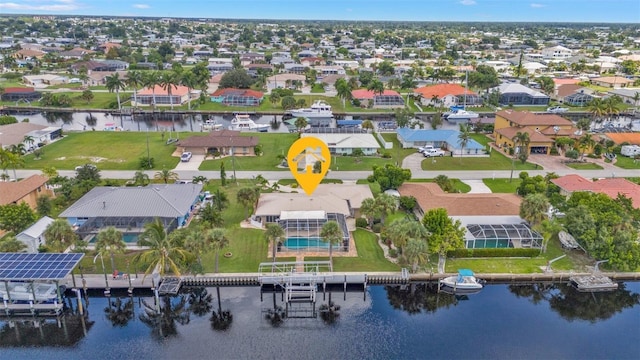 birds eye view of property featuring a water view