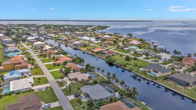 birds eye view of property featuring a water view