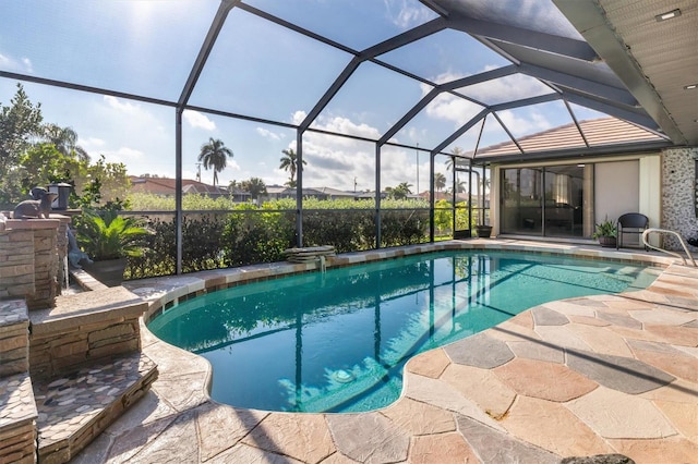 view of pool featuring a lanai and a patio area