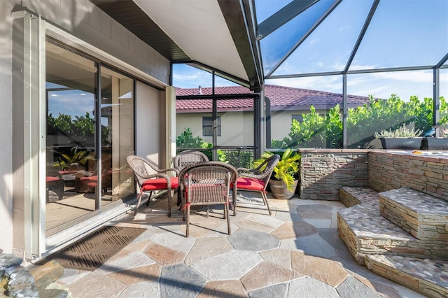 view of patio / terrace with glass enclosure