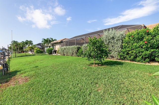 view of yard featuring a lanai