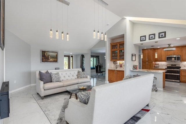 living room featuring high vaulted ceiling