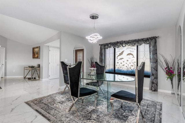 dining area featuring a notable chandelier