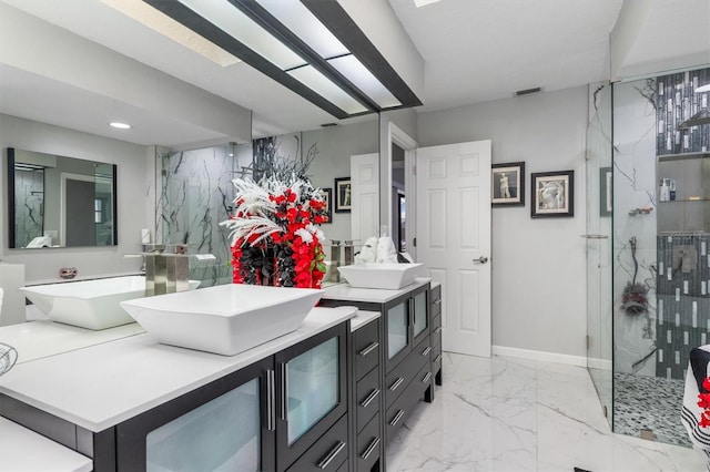 bathroom with vanity and a shower