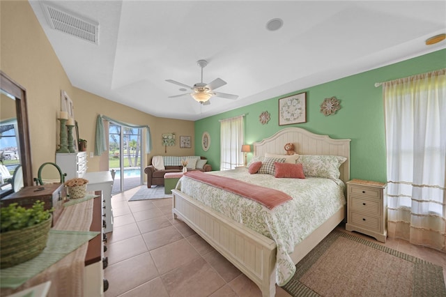 bedroom featuring light tile patterned floors, ceiling fan, and access to exterior