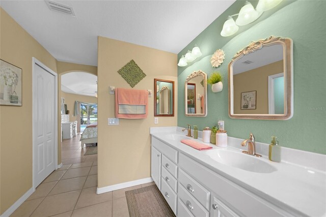 bathroom featuring tile patterned flooring and vanity