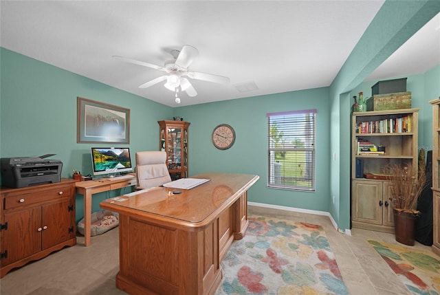 office area featuring baseboards, ceiling fan, and light tile patterned floors